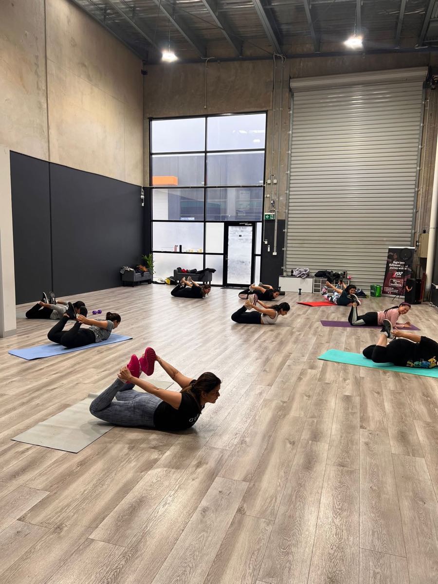 BollyFit members stretching together at NB Studios in Truganina